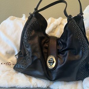 Coach Madison Grommet Carlyle shoulder bag. Very roomie with three compartments.